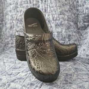 Dansko black tooled leather clogs